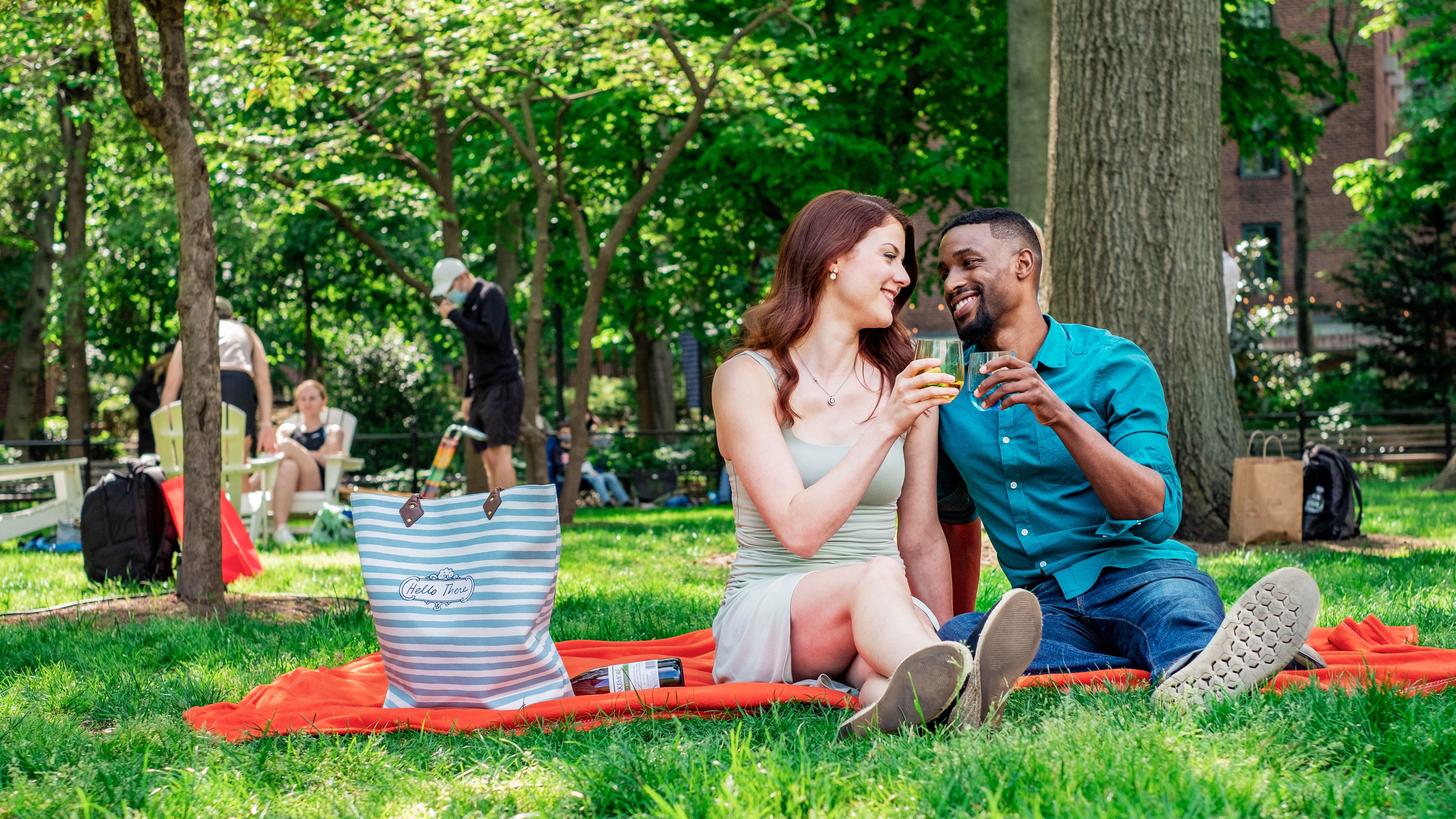 Couple drinking on lawn