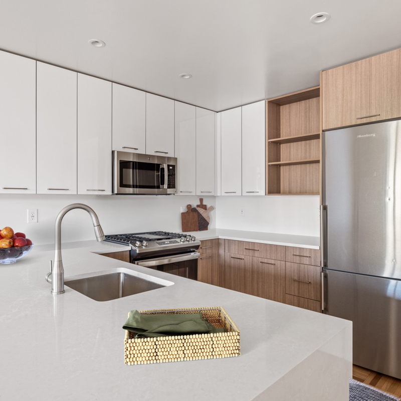 Kitchen with white and wood cabinets, stainless steel appliances