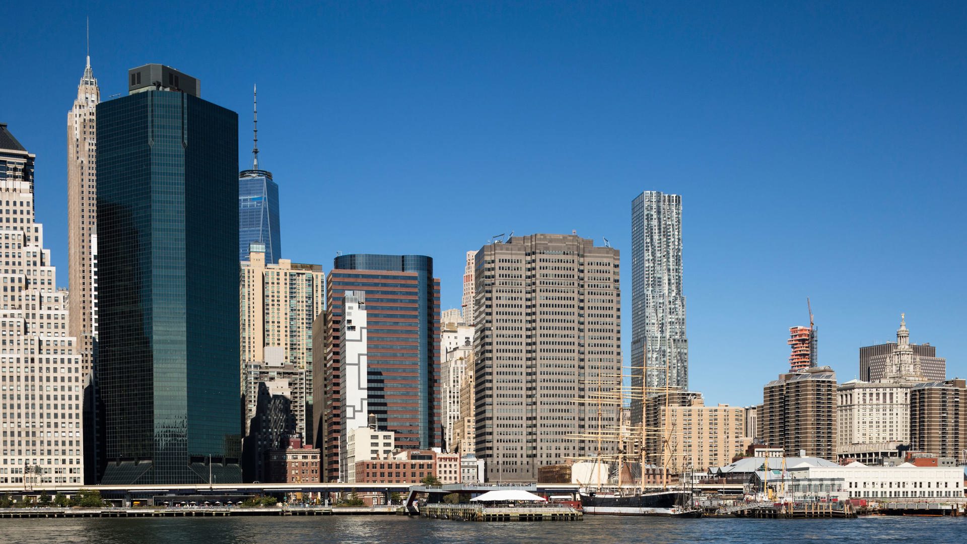 8 Spruce and the lower Manhattan skyline with Financial District towers across the East River