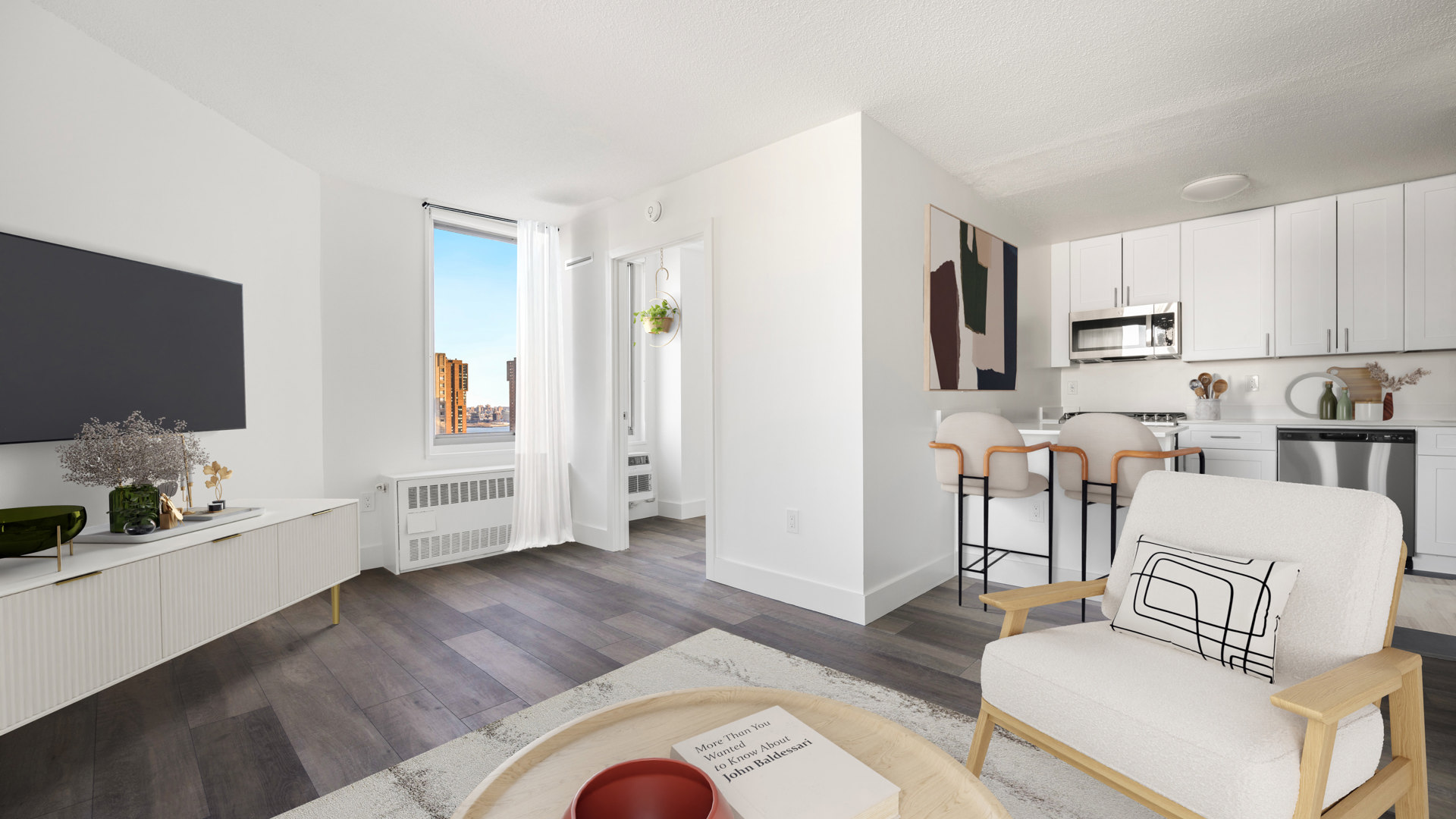 Living Room with white chair, open kitchen, dark hardwood, tv