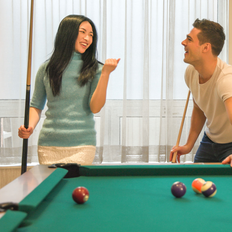2 models playing pool