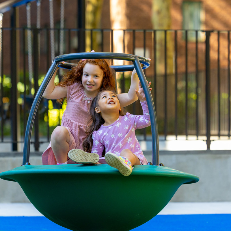 Two girls on spinning ride