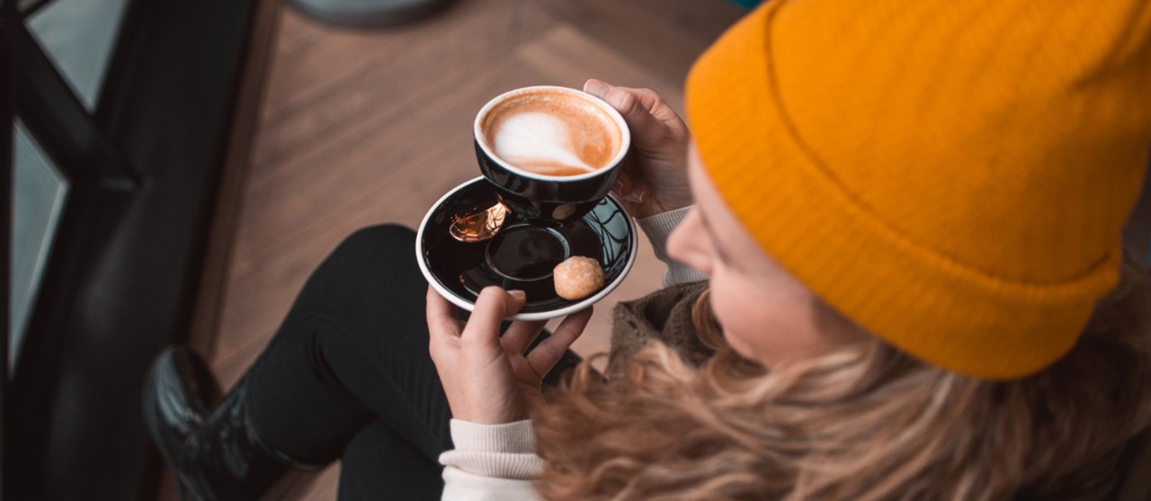 Woman Holding Mug with Coffee