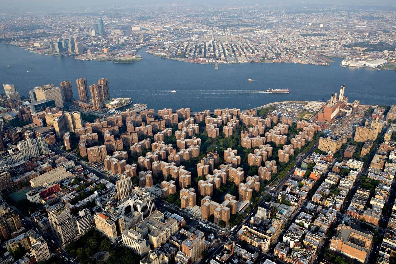 Aerial view of StuyTown's 80 acres with East River and Queens skyline in background