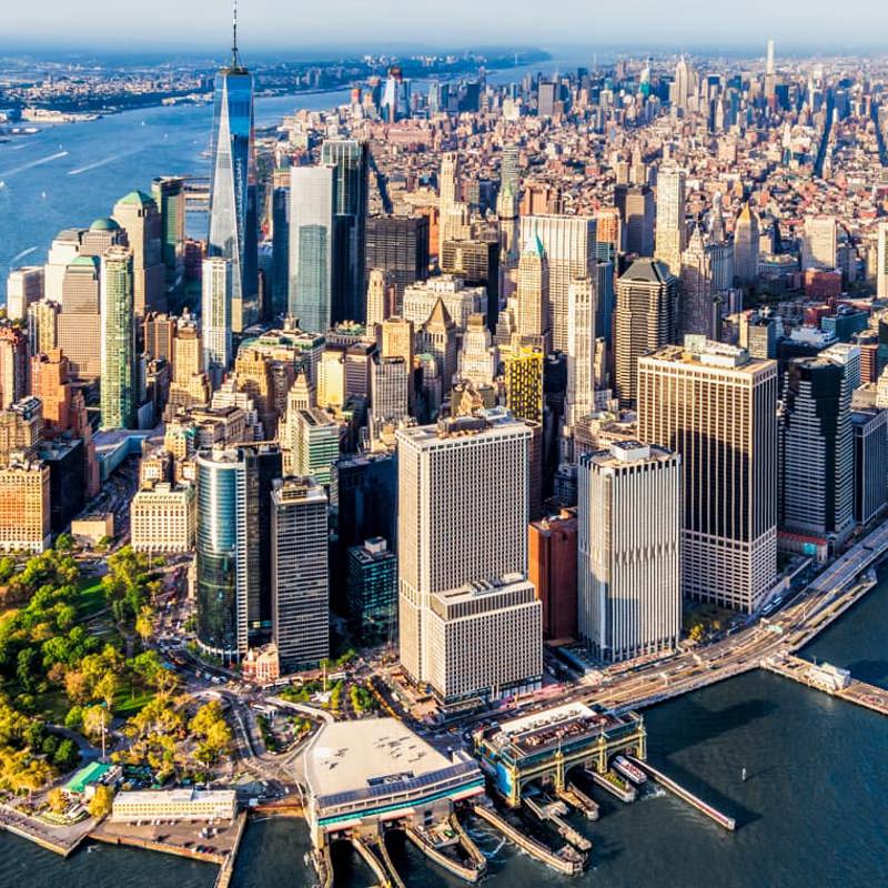 Aerial view of lower Manhattan and the Financial District waterfront on a sunny day