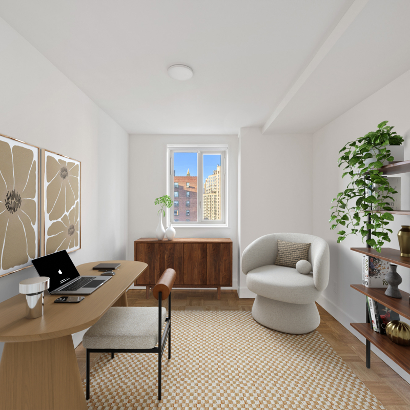 Office with black bookshelf, flower prints, grey chair, wood desk